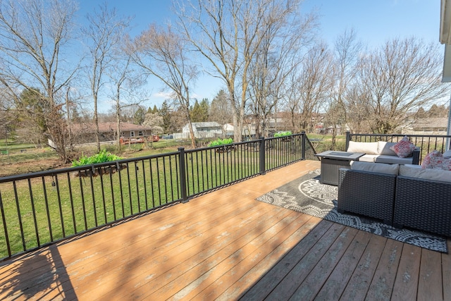 wooden terrace with a yard and an outdoor hangout area