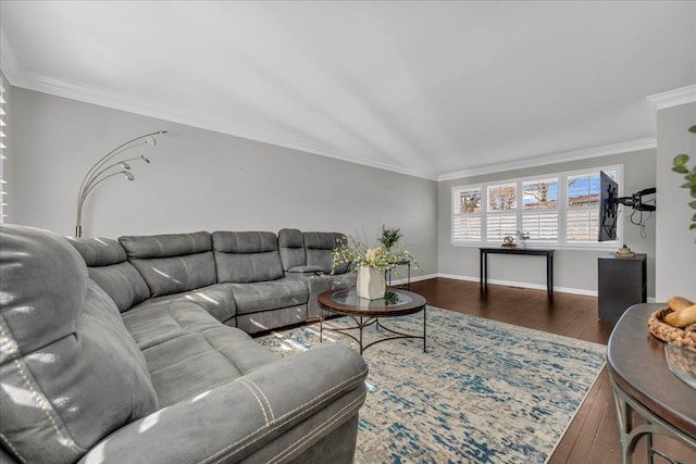 living room featuring baseboards, ornamental molding, and wood finished floors