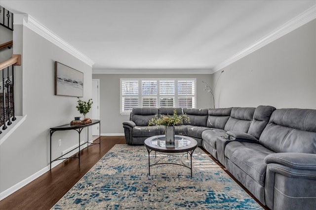 living room with baseboards, ornamental molding, and dark wood finished floors