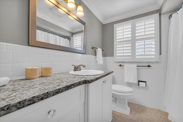 bathroom featuring vanity, ornamental molding, toilet, tile walls, and a wealth of natural light