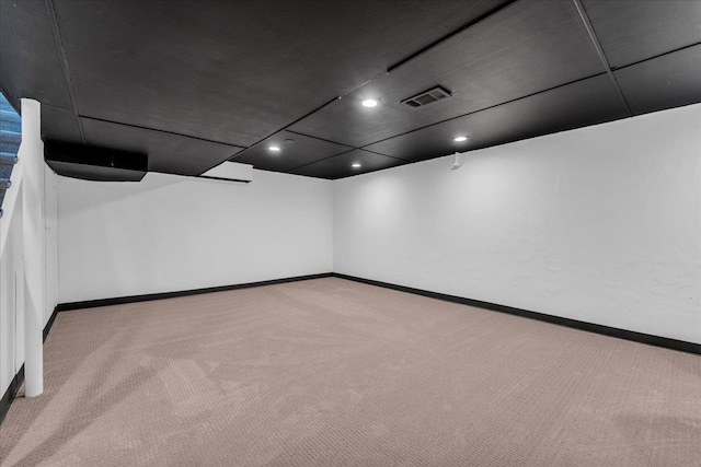 carpeted empty room with recessed lighting, baseboards, and visible vents
