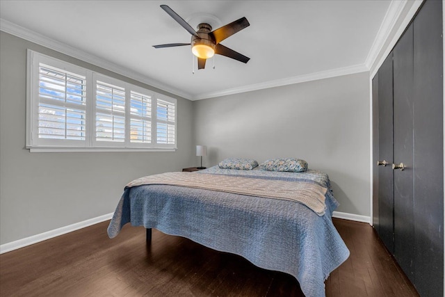 bedroom featuring ceiling fan, baseboards, ornamental molding, and wood finished floors