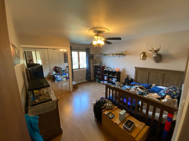 bedroom with wood finished floors and ceiling fan