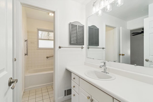 bathroom with tile patterned floors, visible vents, and vanity