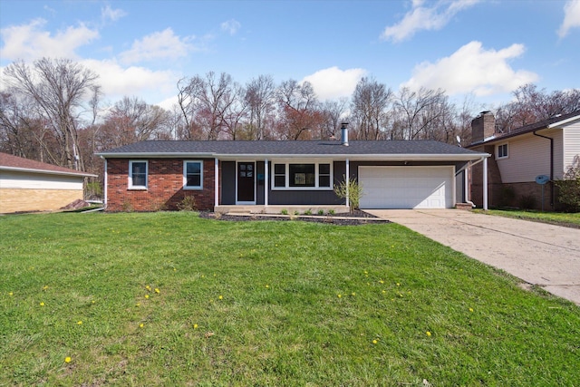 single story home with a front yard, concrete driveway, a garage, and brick siding