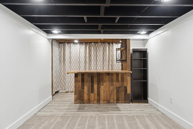 finished basement featuring baseboards