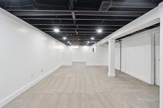 finished below grade area with baseboards and carpet