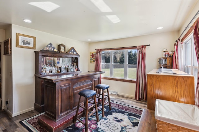 8023 Bray Rd, Vassar, MI 48768 - indoor dry bar featuring baseboards, wood finished floors, and recessed lighting