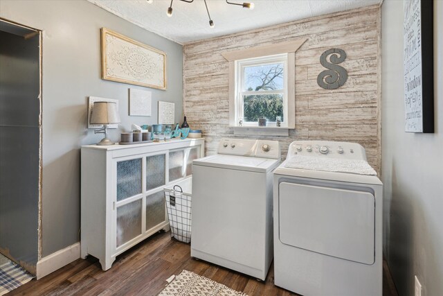 laundry area featuring dark wood-type flooring, laundry area, and washing machine and dryer