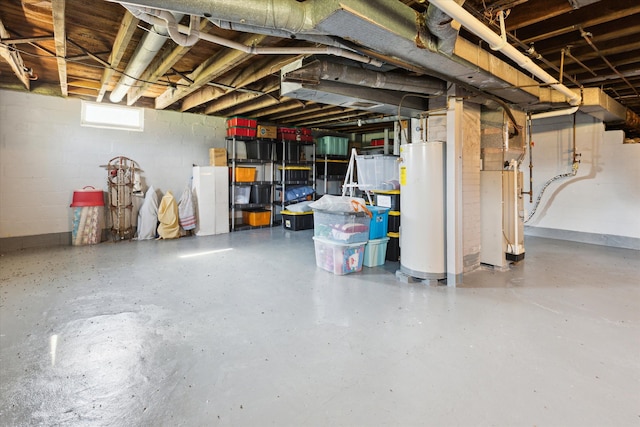 basement featuring concrete block wall and gas water heater