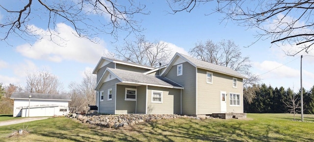 8023 Bray Rd, Vassar, MI 48768 - view of side of home with an outbuilding, a yard, roof with shingles, and a garage