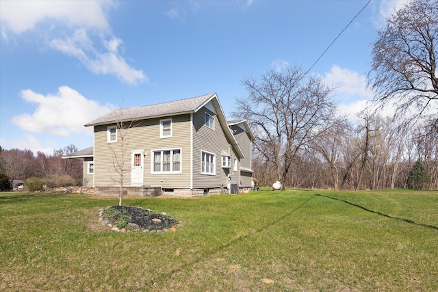 view of home's exterior featuring a lawn