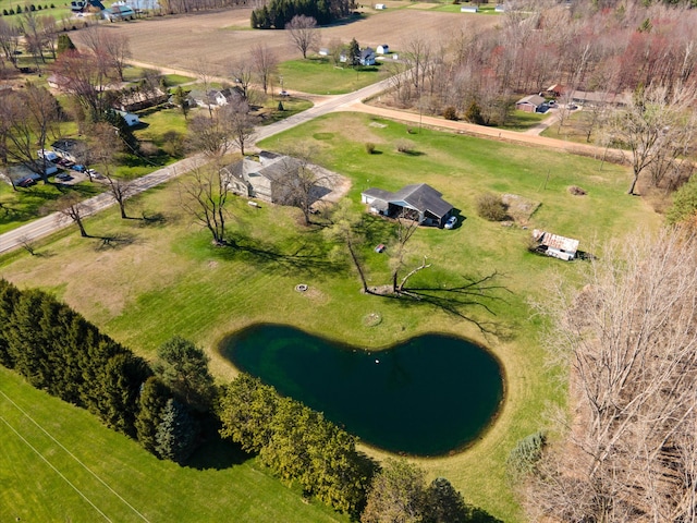 birds eye view of property with a water view and a rural view