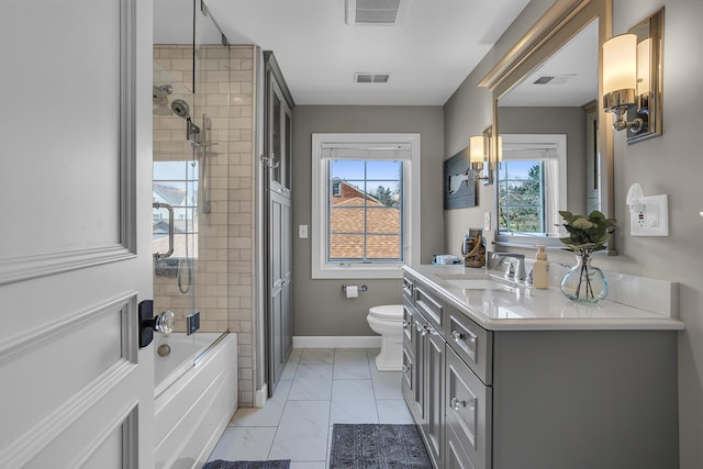 bathroom with toilet, visible vents, and a healthy amount of sunlight