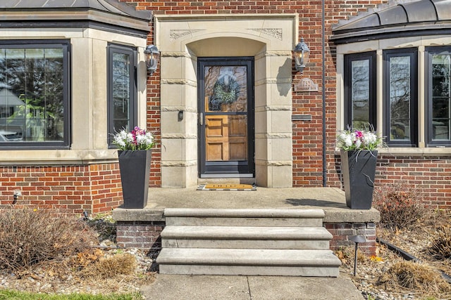 entrance to property with brick siding