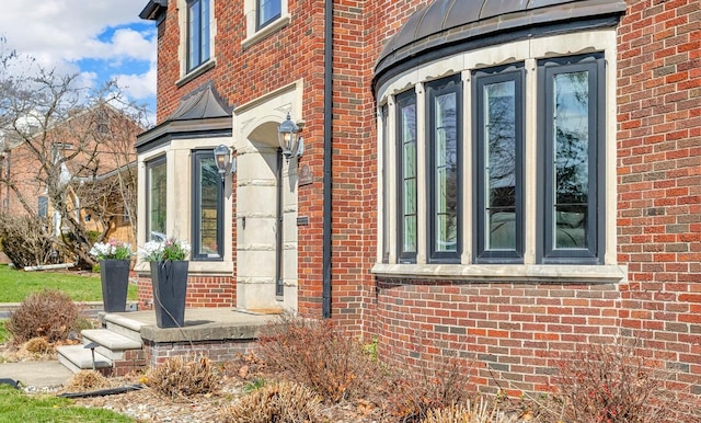 view of property exterior featuring brick siding