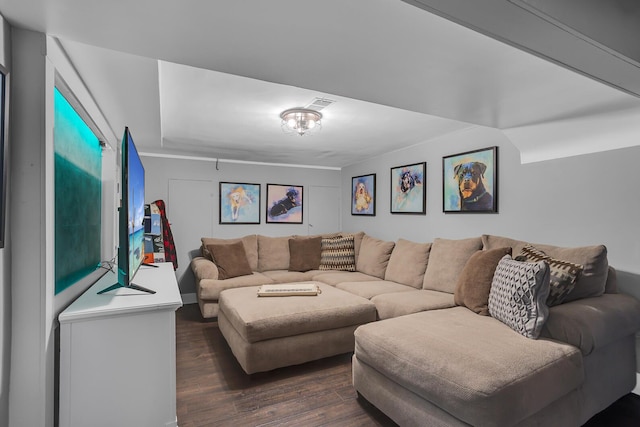 living room featuring visible vents and dark wood finished floors