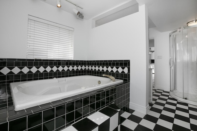 full bath with tile patterned floors, baseboards, a shower stall, and a bath