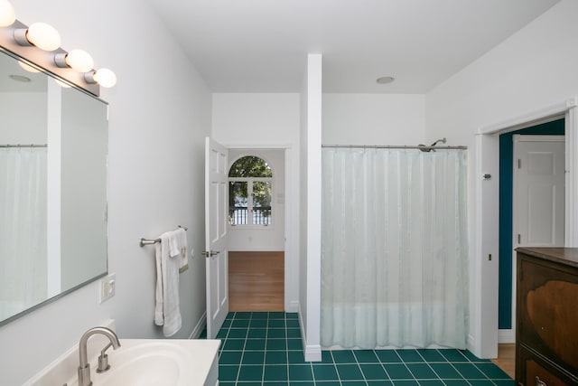 bathroom featuring tile patterned floors, a shower with shower curtain, and vanity
