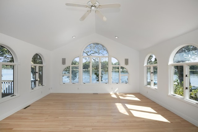 unfurnished sunroom featuring french doors, visible vents, and a water view