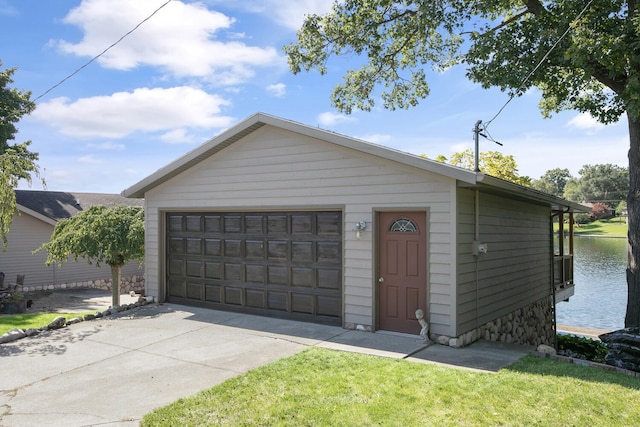 detached garage with a water view