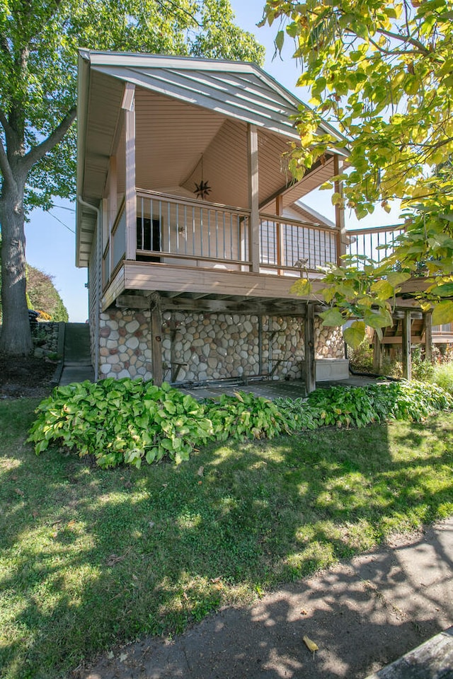 exterior space featuring a deck and a ceiling fan