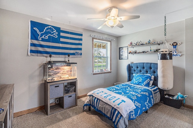 carpeted bedroom with a ceiling fan and baseboards