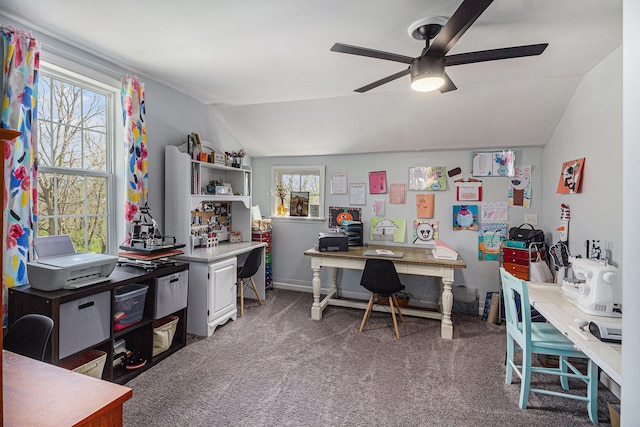 office area with baseboards, ceiling fan, carpet, and vaulted ceiling