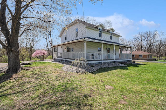 view of front of property featuring a front yard and covered porch