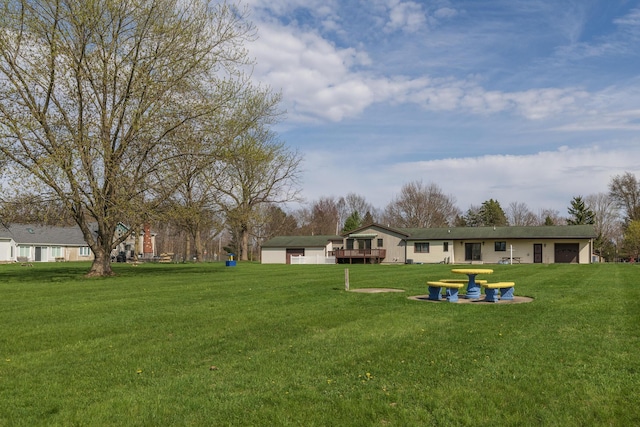 view of yard featuring a wooden deck