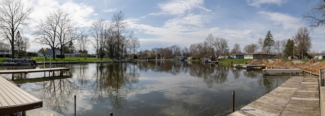 dock area with a water view and a residential view