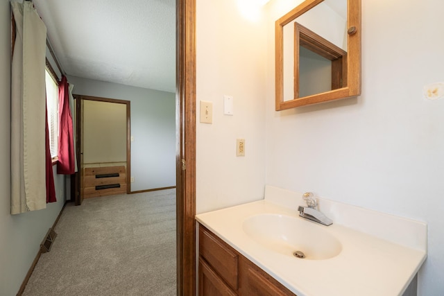 bathroom featuring visible vents and vanity