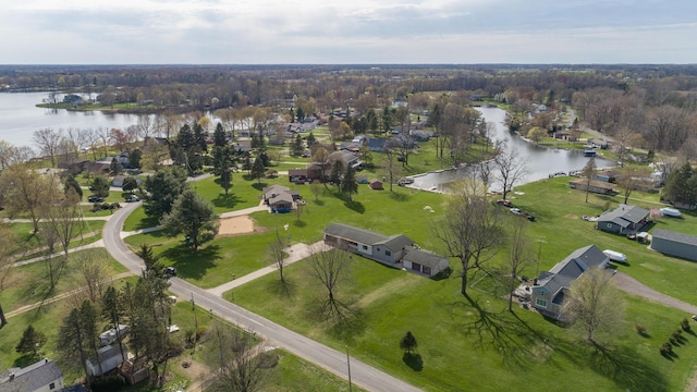 drone / aerial view featuring a residential view and a water view