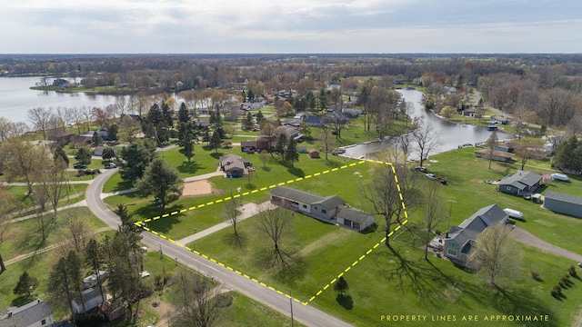 aerial view featuring a residential view and a water view