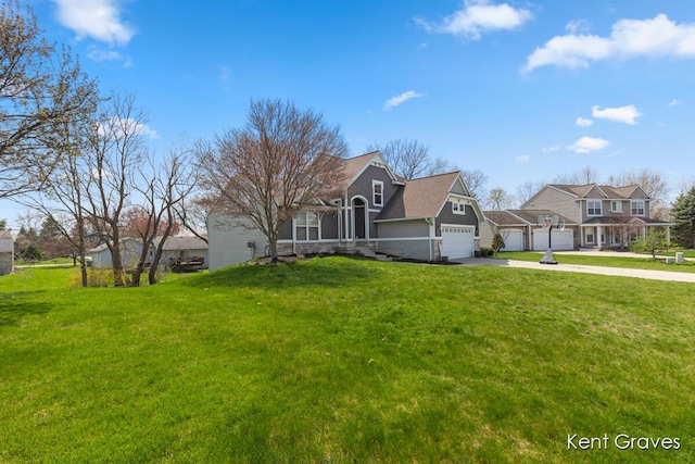 view of front facade with a front lawn, driveway, and a residential view