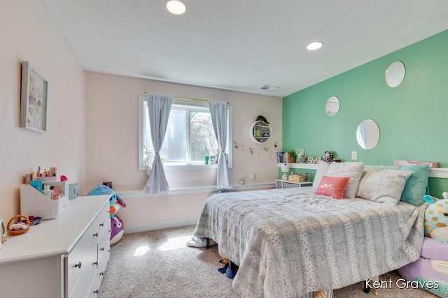 bedroom with carpet flooring, recessed lighting, and visible vents