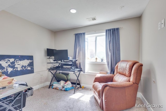 carpeted home office with baseboards and visible vents
