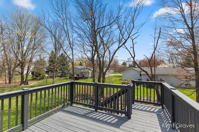 deck featuring a residential view and a yard