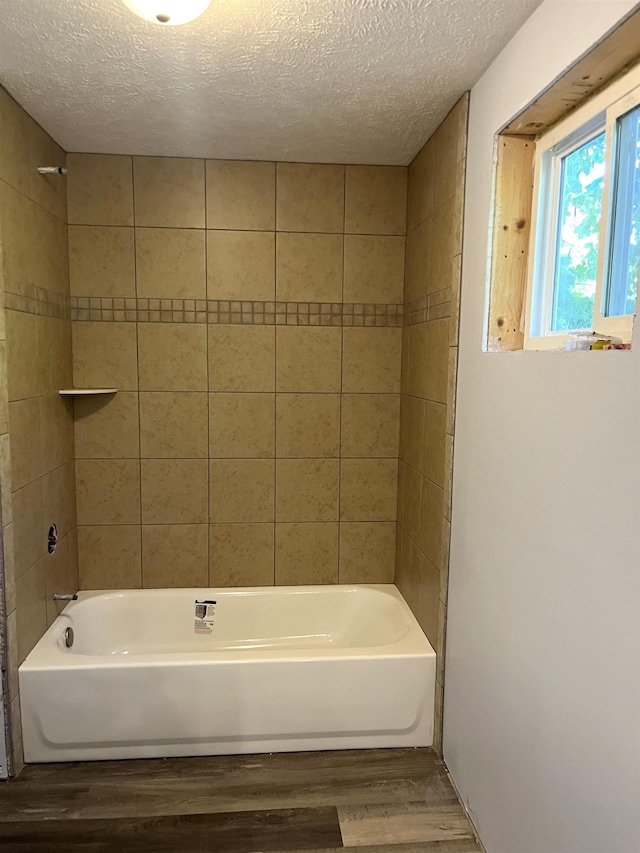 2759 N Dr, Traverse City, MI 49685 - full bathroom featuring a textured ceiling, bathtub / shower combination, and wood finished floors