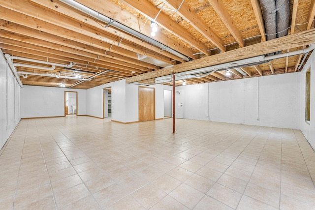 basement with tile patterned flooring