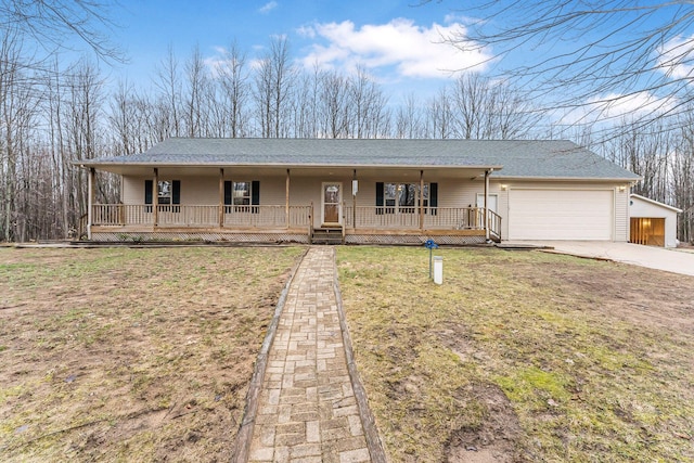ranch-style home featuring driveway, a shingled roof, an attached garage, a porch, and a front lawn