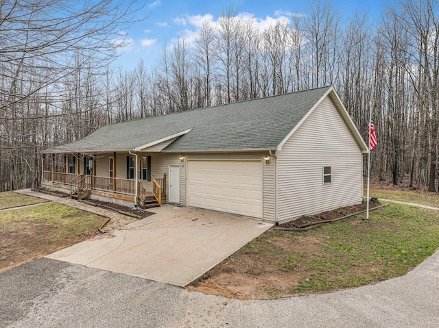 single story home with driveway, roof with shingles, covered porch, a front yard, and an attached garage