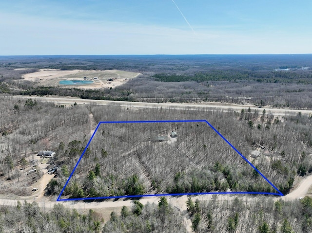 birds eye view of property featuring a rural view
