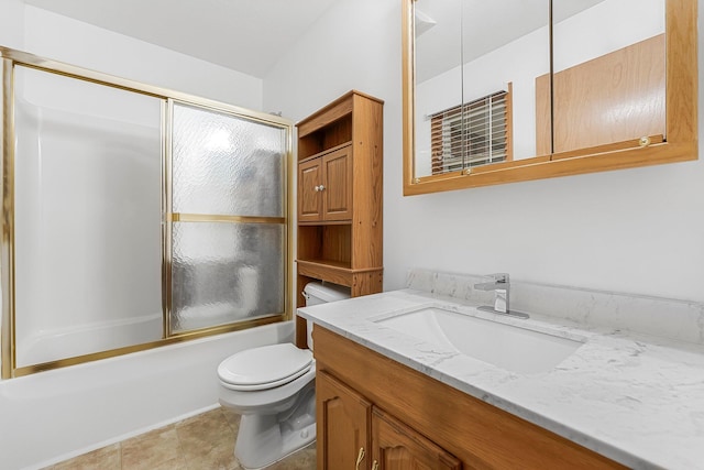 bathroom with enclosed tub / shower combo, toilet, and vanity