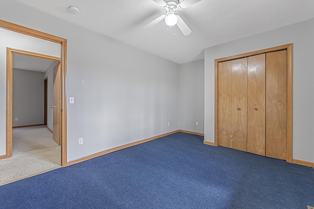 unfurnished bedroom with a ceiling fan, a closet, carpet, and baseboards