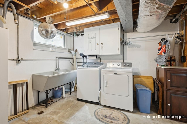 1456 54th St SE, Grand Rapids, MI 49508 - clothes washing area with cabinet space and washing machine and dryer