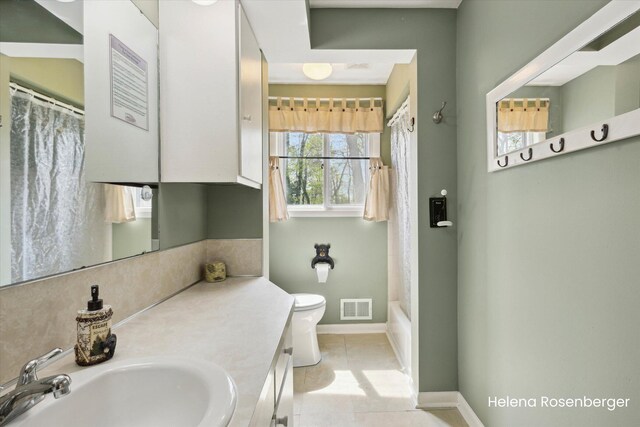 1456 54th St SE, Grand Rapids, MI 49508 - bathroom featuring vanity, toilet, tile patterned floors, baseboards, and visible vents
