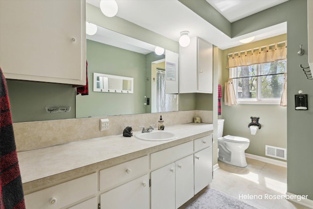 1456 54th St SE, Grand Rapids, MI 49508 - bathroom featuring vanity, toilet, tile patterned floors, baseboards, and visible vents