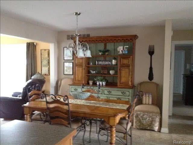 14922 Wildwood Dr, Monroe, MI 48161 - dining space with a notable chandelier