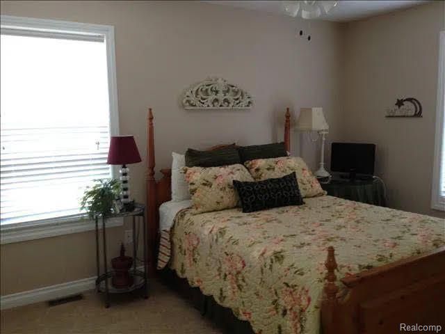 14922 Wildwood Dr, Monroe, MI 48161 - bedroom featuring baseboards